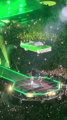 Milan concert features green car stage prop and lighting effects