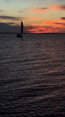 Sailboat "Gray Neck" observed during sunset sail near Kokshetau