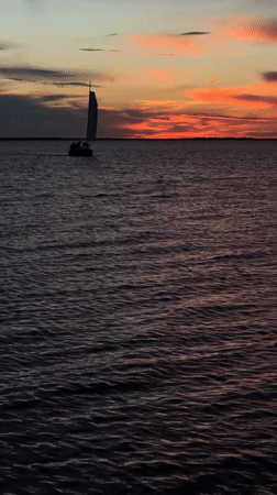 Sailboat "Gray Neck" observed during sunset sail near Kokshetau