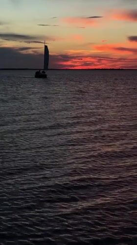 Sailboat "Gray Neck" observed during sunset sail near Kokshetau