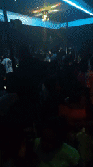 Nightclub crowd dances under colorful lights in Lokoja, Nigeria