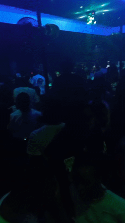 Nightclub crowd dances under colorful lights in Lokoja, Nigeria