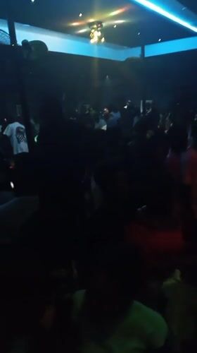Nightclub crowd dances under colorful lights in Lokoja, Nigeria