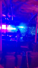 Nightclub scene captured with patrons walking toward bar