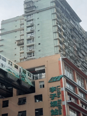 Tourists flock to Chongqing's train-through-building station for photos