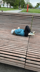Child plays at playground, rests on benches in Veliky Novgorod