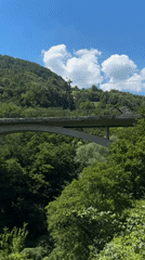 Cliff-side trail and concrete arch bridge near Užice, Serbia