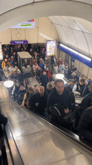 Busy escalator scene captured at Saint Petersburg subway station