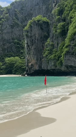 Limestone-framed bay beach with turquoise water, Ao Nang