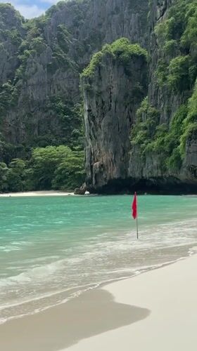 Limestone-framed bay beach with turquoise water, Ao Nang