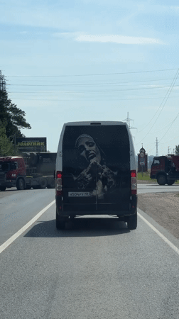 White van with Jesus image rolls through Russian roads