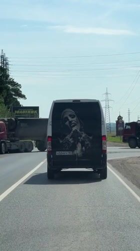 White van with Jesus image rolls through Russian roads