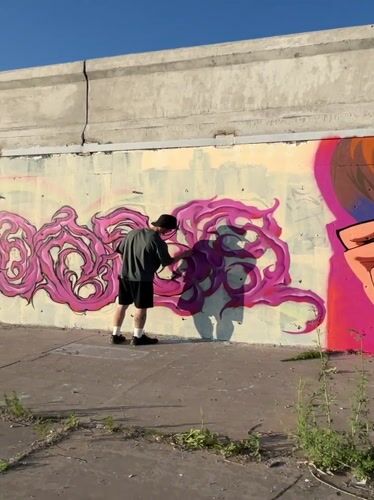 Khabarovsk waterfront at sunset: graffiti, river views, and street life