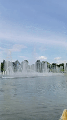 Families enjoy water fountains at Wrocław's Centennial Hall park