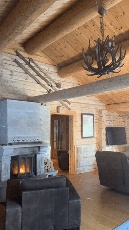 Cozy cabin fireplace scene captured in snowy Ringebu Norway