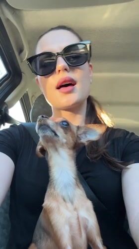 Woman and dog captured in vehicle selfie in Chaykovsky