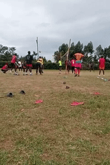 Community volleyball game held on makeshift court in Kenya