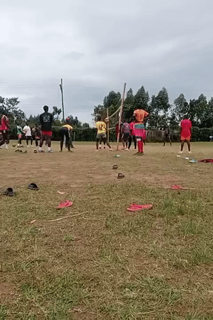 Community volleyball game held on makeshift court in Kenya