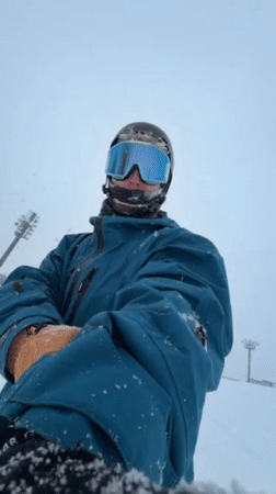 Snowboarder hits slopes in Kutchan, Japan winter conditions