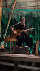 Live acoustic performance in an open-air Ubud pavilion