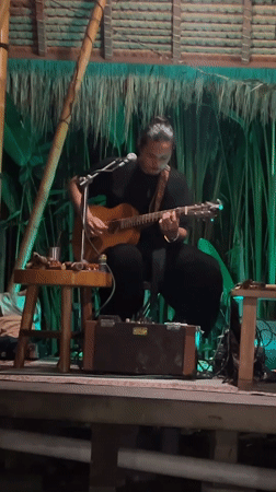 Live acoustic performance in an open-air Ubud pavilion