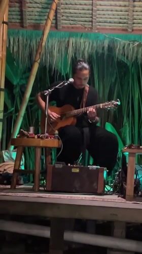 Live acoustic performance in an open-air Ubud pavilion