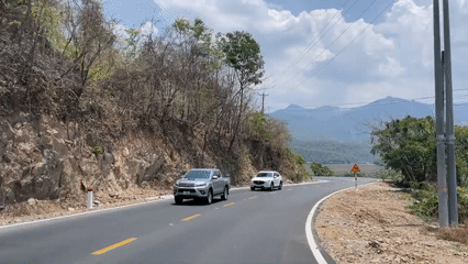 Morning traffic flows through mountain roads in rural Vietnam