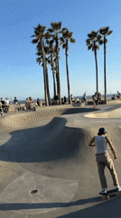 Early morning skateboarding and running activity at Venice Beach