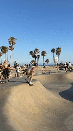Early morning skateboarding and running activity at Venice Beach