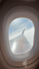 Passenger films Wizz Air wing view during Portugal flight