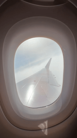 Passenger films Wizz Air wing view during Portugal flight