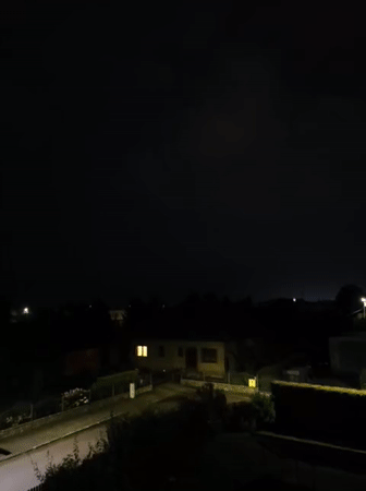 Late-night storm rolls through Tczew, rain and lightning over quiet streets