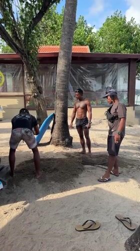 Kuta Beach surf session with lessons, waves, and beachgoers