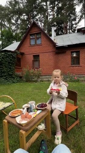 Backyard snack spread and morning treats in a Russian yard