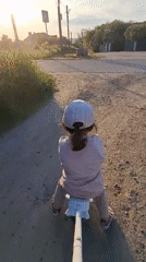 Child plays at Timmolovo playground during afternoon hours