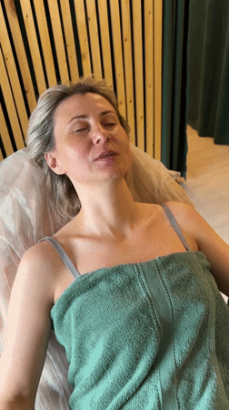 Woman rests peacefully on bed in Nizhnevartovsk