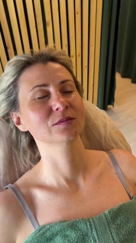 Woman rests peacefully on bed in Nizhnevartovsk