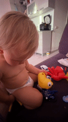 Toddler playtime at home in Sochi, squeegee included