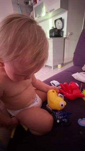 Toddler playtime at home in Sochi, squeegee included
