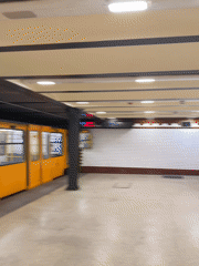 Yellow subway train 31 stops at Budapest underground station