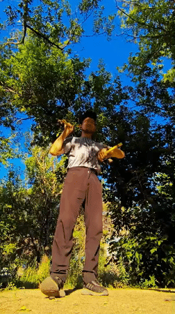 Yellow nunchucks in a Karaganda park on a clear day