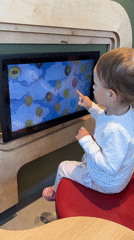 Toddler plays touch screen game in Ustroń, Poland