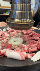 Korean BBQ preparation captured at Seoul restaurant
