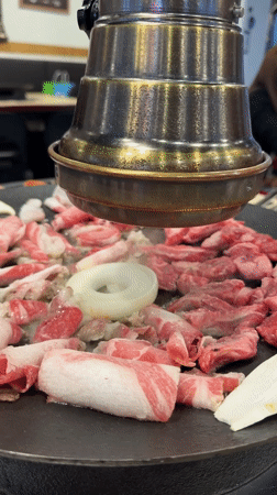 Korean BBQ preparation captured at Seoul restaurant