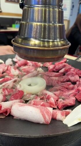 Korean BBQ preparation captured at Seoul restaurant