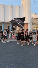 Youth parade procession coincides with sunset at Espinho beach