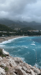 Choppy turquoise waters at Kamenovo beach on a misty morning