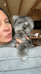 Woman spends quiet afternoon with grey dog in Chaikovsky