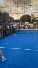 Two men play padel on blue court in Chișinău
