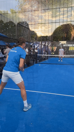 Two men play padel on blue court in Chișinău